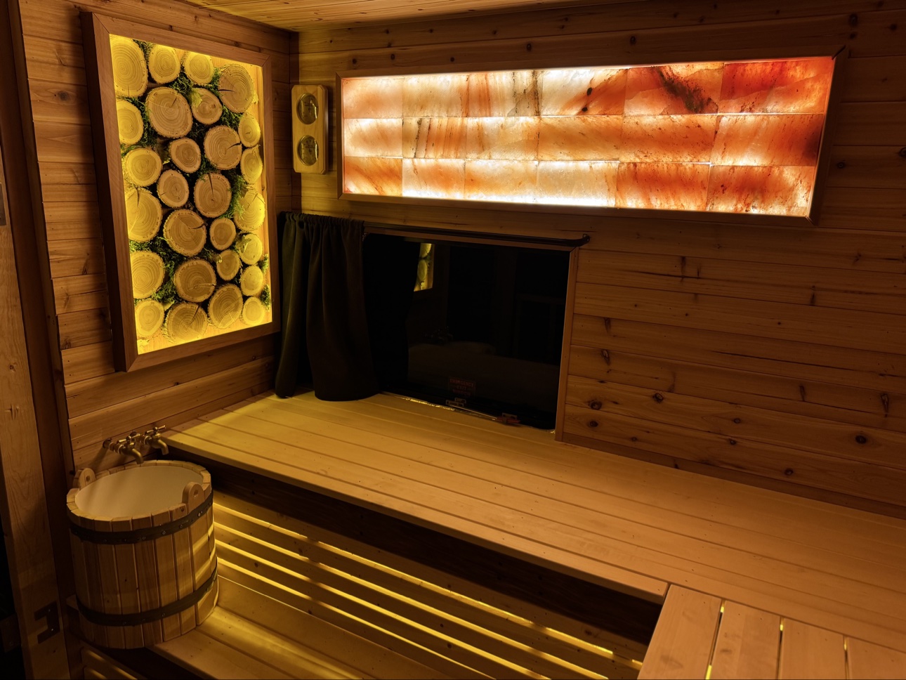 Wooden mobile sauna interior, glowing stove